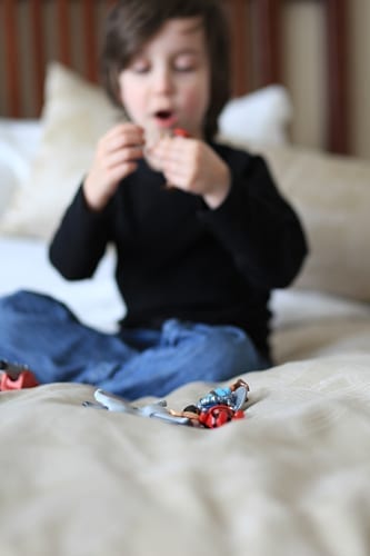 Playmobil vacation on a hotel bed
