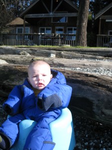 a baby on the beach at orcas island washington state