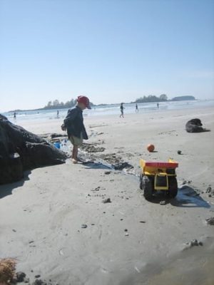 At the beach in Tofino with kids.